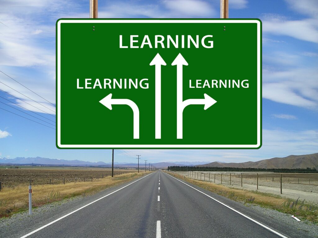 learning sign over a road