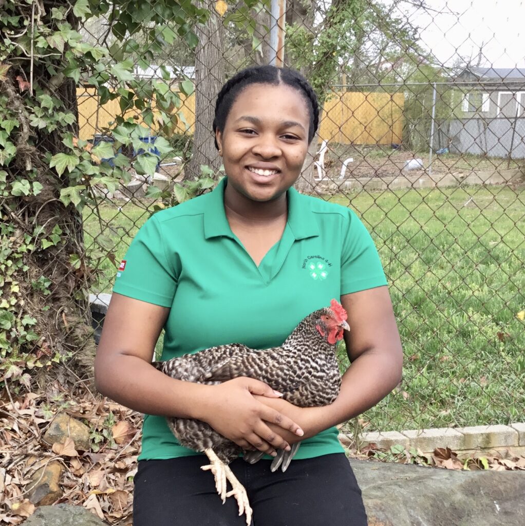 Woman holding chicken