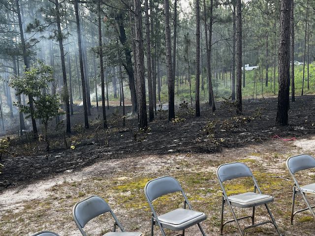 Chairs in front of a burn.